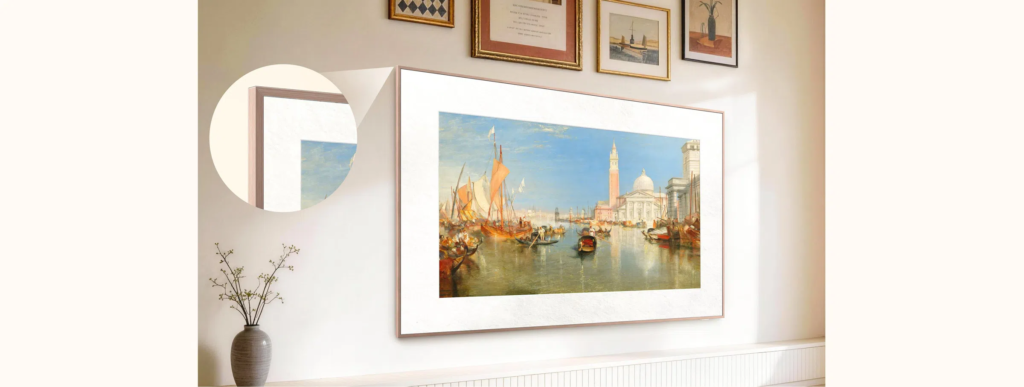 image | TCL Kenya Large harbor painting with boats and a domed building, framed and hung on a light wall, with a circular mirror to the left and a vase of branches bottom left.